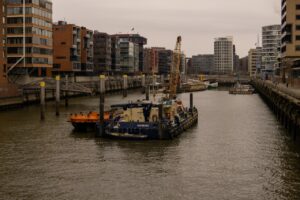 Captivating daytime view of Hamburg's HafenCity buildings and harbor.